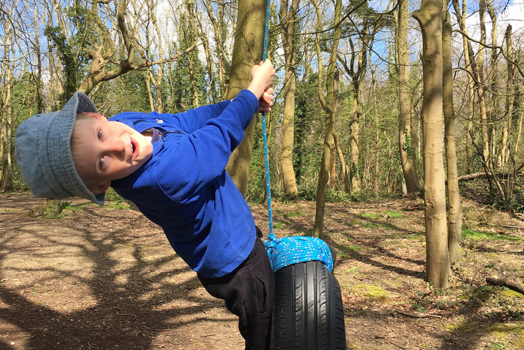 Boy on a tyre swing